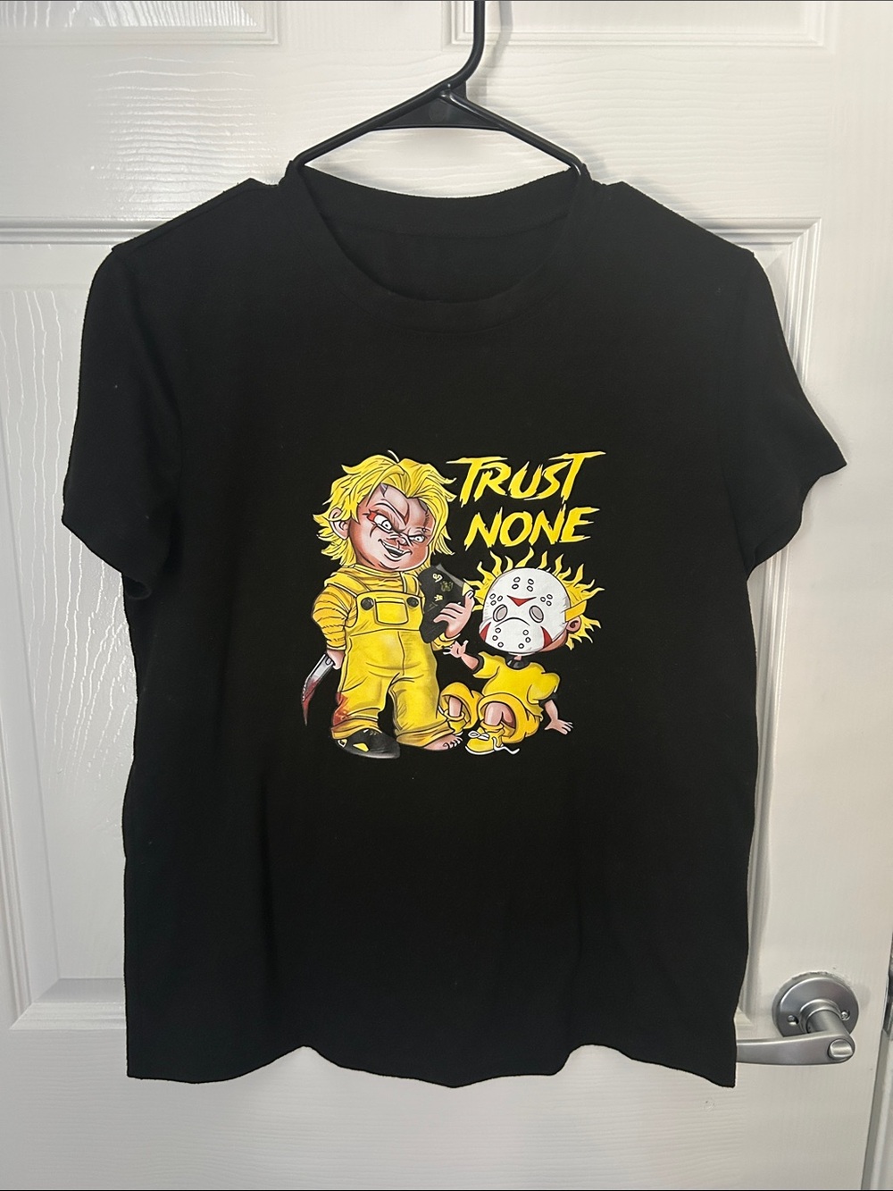 SHEIN Black Graphic Tee with Yellow 'Trust None' Cartoon Print